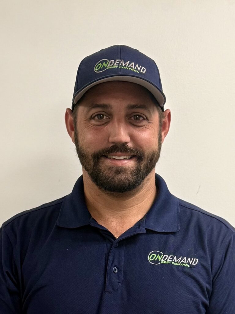 Vincent Luca, owner of On Demand Pest Control, Davie, Florida, in company uniform and cap